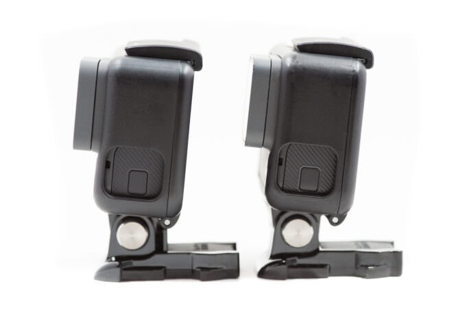 A GoPro HERO6 Black side-by-side with a HERO5 Black, seen from the side.