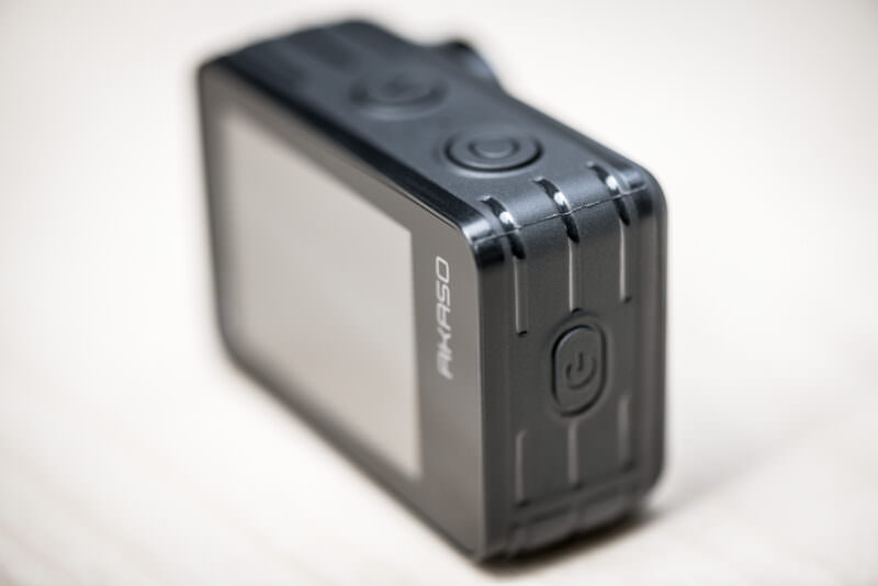 Side view of the AKASO Brave 7 LE highlighting the power and wifi button
