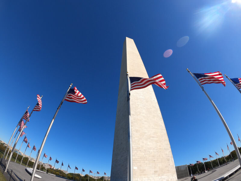 Washington Monument shot with the GoPro HERO8 Black's wide-angle lens, flags framing the obelisk under blue sky
