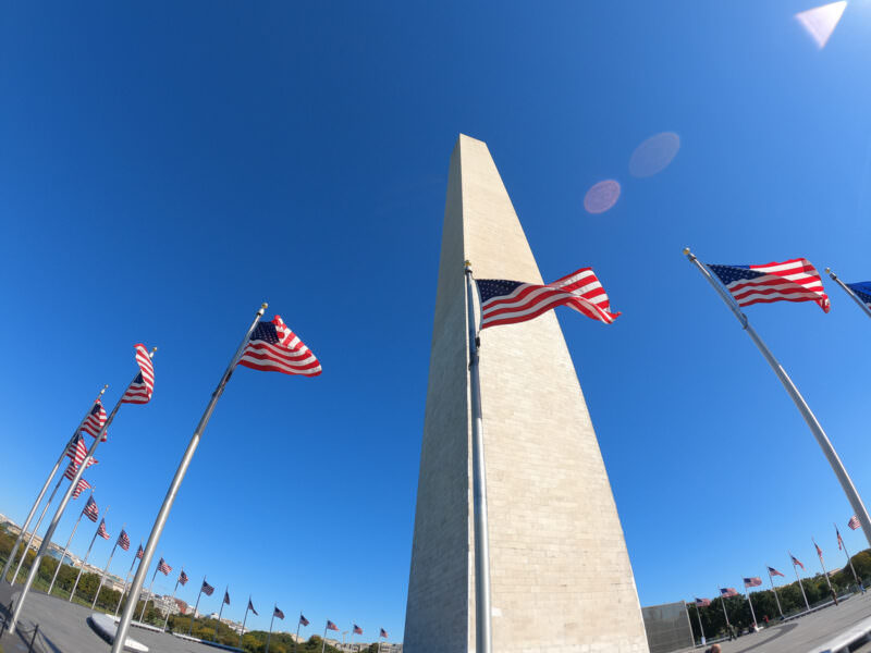 Washington Monument shot with the GoPro HERO9 Black's wide-angle lens, flags framing the obelisk under blue sky