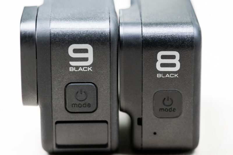 GoPro HERO9 Black and HERO8 Black side by side showing model labels and mode power buttons
