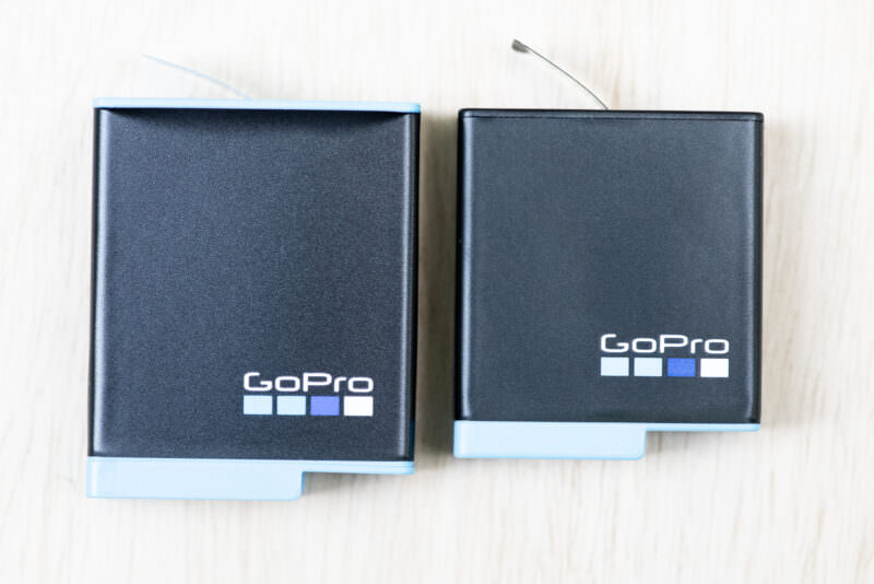 GoPro HERO9 Black and HERO8 Black rechargeable batteries laid flat showing their GoPro logo sides