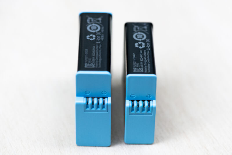 GoPro HERO9 Black and HERO8 Black batteries stood upright comparing their connector pins and height