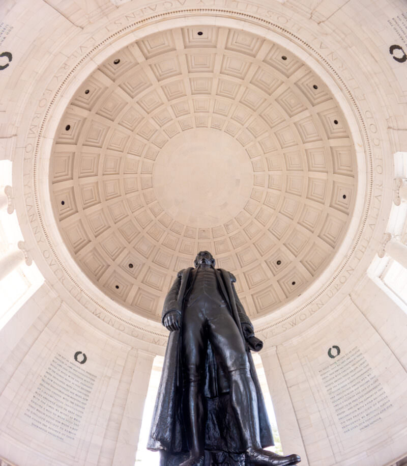 Thomas Jefferson Memorial statue viewed upward into its coffered dome interior in Washington DC