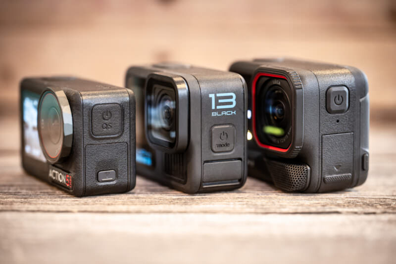 DJI Osmo Action 5 Pro, GoPro HERO13 Black, and Insta360 Ace Pro 2 action cameras lined up side by side
