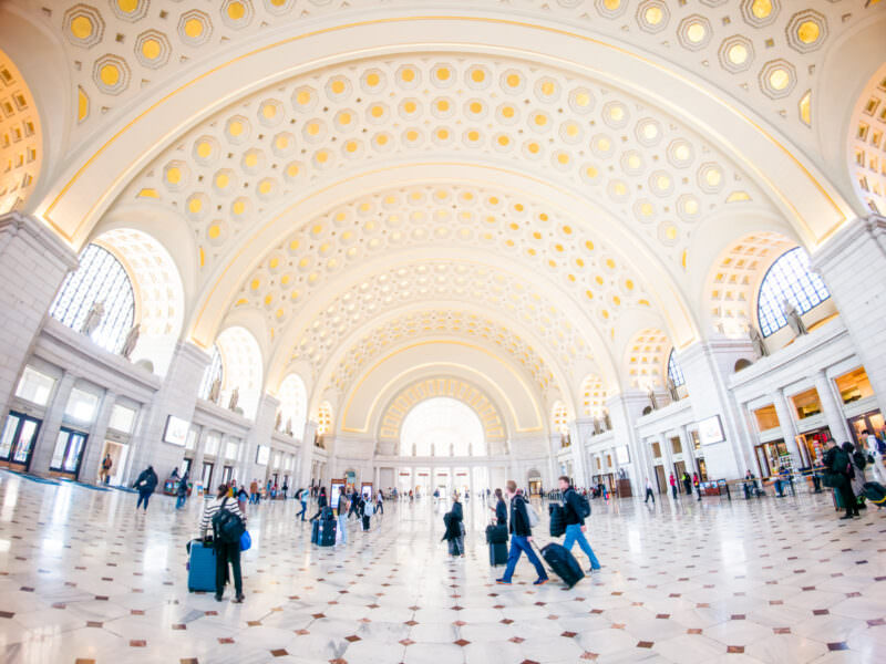 Sample photo from the Insta360 Ace Pro 2 of travelers crossing the marble floor of Union Station's main hall