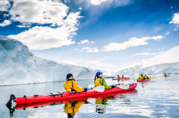 Kayakers Glaciers Icebergs Snow Covered Mountains Neko Harbour Antarctic Peninsula Antarctica