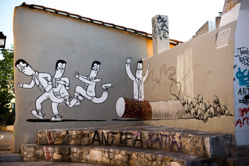 Athens mural of cartoon businessmen running in line toward a paint roller and blank space, painted on a stepped neighborhood wall