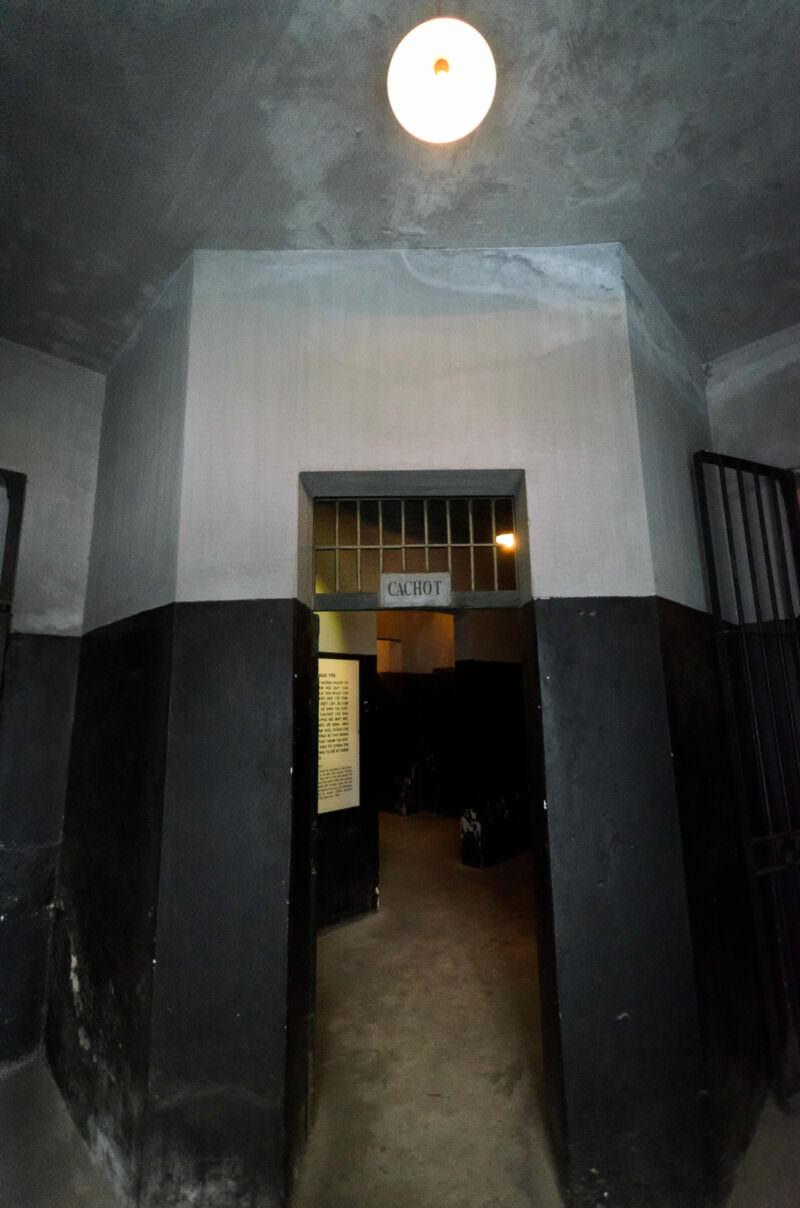CACHOT sign above the entrance to the solitary confinement wing at Hoa Lo Prison