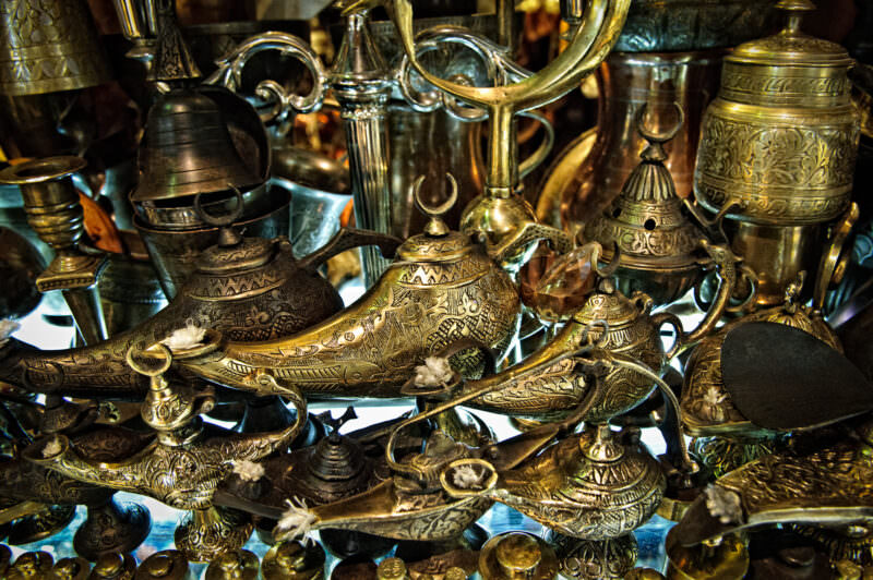 Engraved brass lamps styled after Aladdin's lamp piled together in a Grand Bazaar metalwork shop