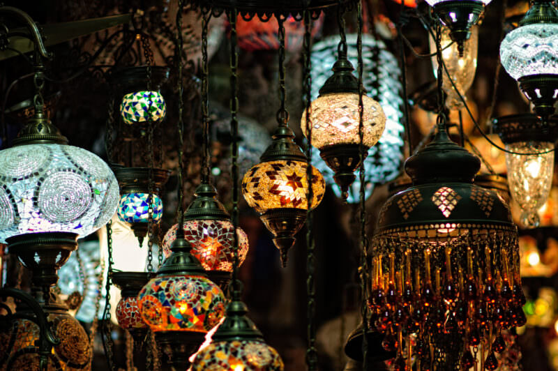 Tight cluster of teardrop mosaic glass lamps with hand-cut colored panes at a Grand Bazaar lamp stall