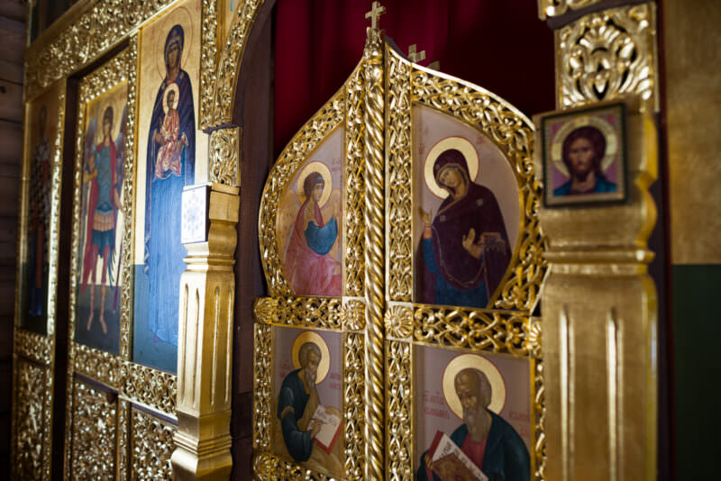 Gilded iconostasis with tiers of sacred icons inside Trinity Church at Bellingshausen Station, King George Island