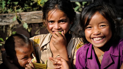 Smiling Village Children Eating Green Fruit Holding Reeds Luang Namtha Laos
