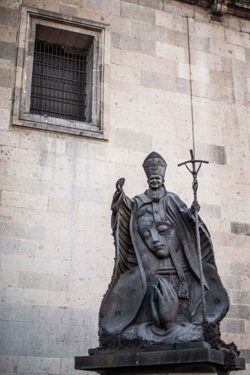 Bronze sculpture Llaves de Fe depicting Pope John Paul II above a Virgin of Guadalupe relief