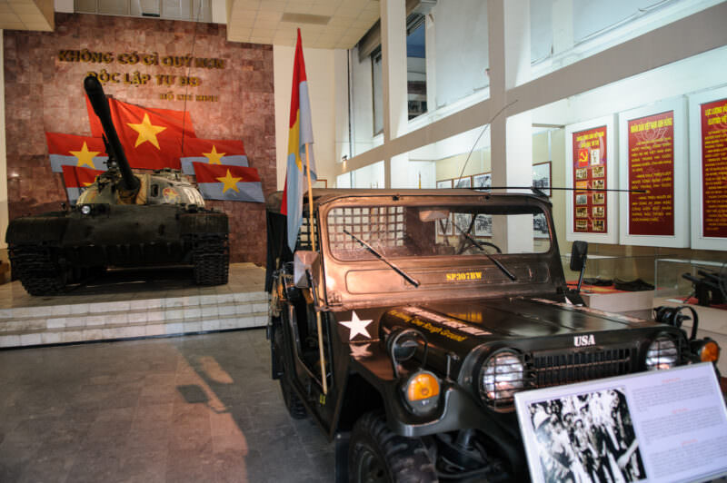 Captured U.S. M151 jeep parked beside the T-54B tank under Ho Chi Minh's independence quotation