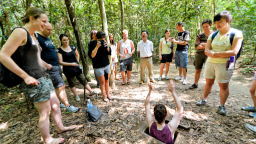 Cu Chi Tunnels Tourist Entering Camouflaged Trapdoor Ho Chi Minh City Vietnam