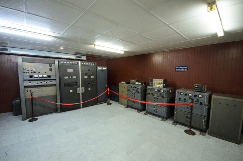 Rows of vintage transmitters and radio gear in the Spare Radio Station of Reunification Palace's bunker
