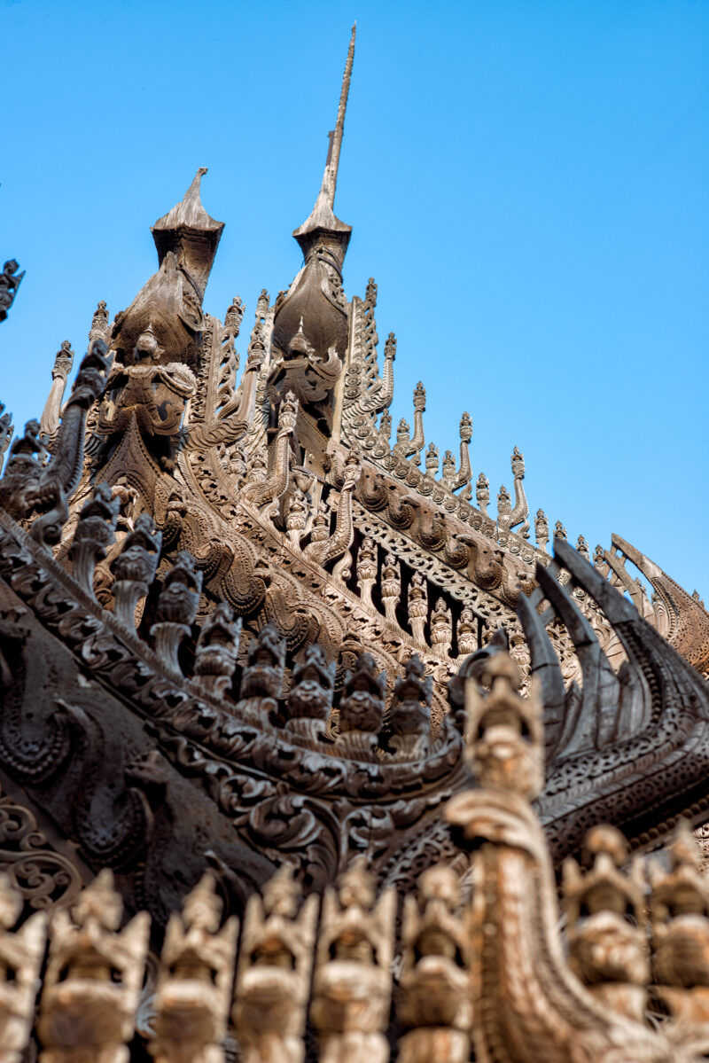 Shwenandaw Monastery pyatthat spire roof with nagas, celestial figures, and foliate cresting in stacked diminishing tiers