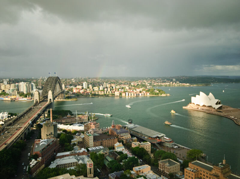 Elevated view of maritime traffic between Sydney Harbour Bridge and Sydney Opera House on Bennelong Point