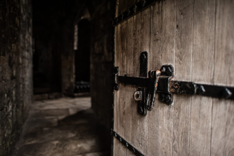 Solid oak door leading into room at Caernarfon Castle