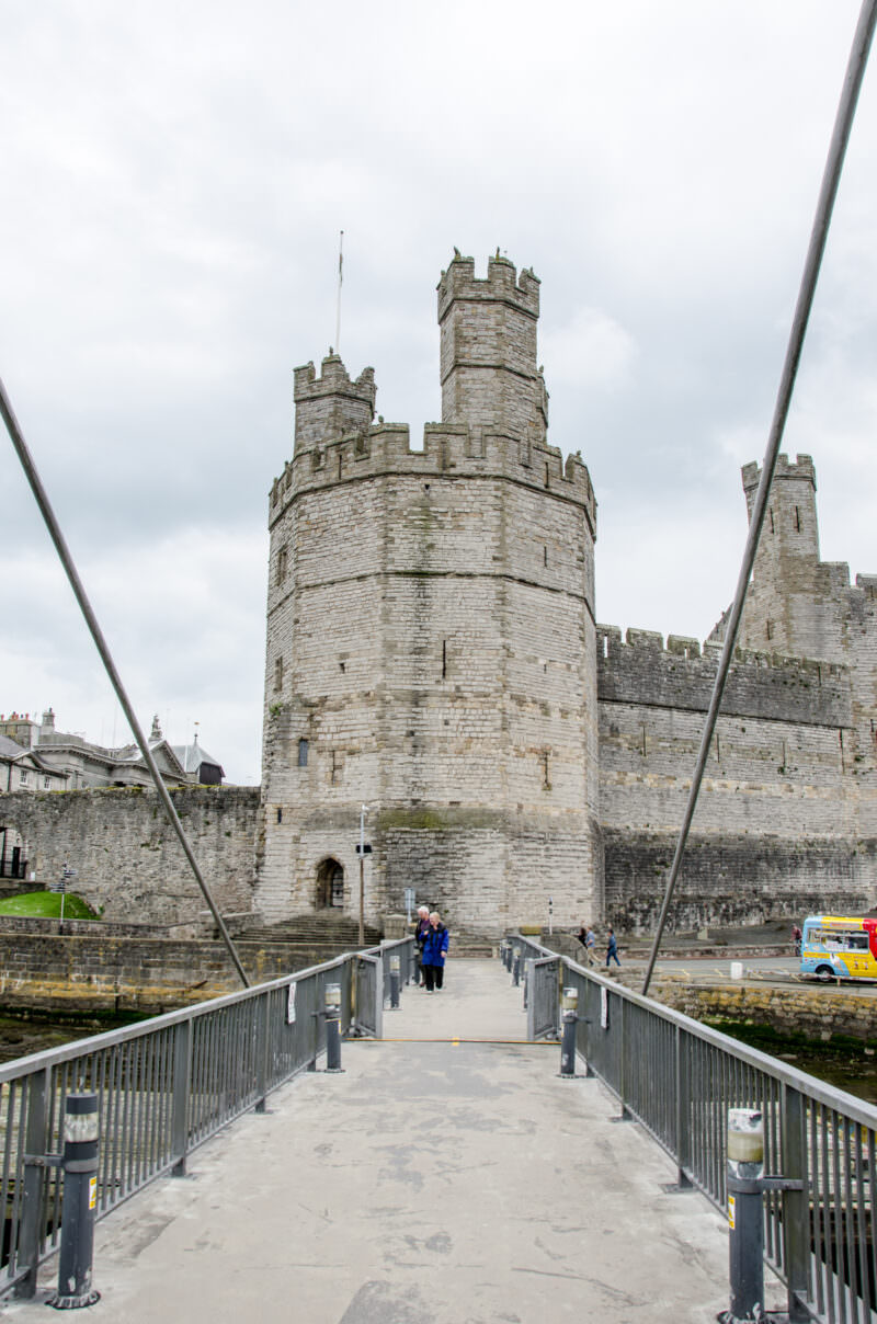 Drawbridge spanning moat at entrance to Caernarfon Castle