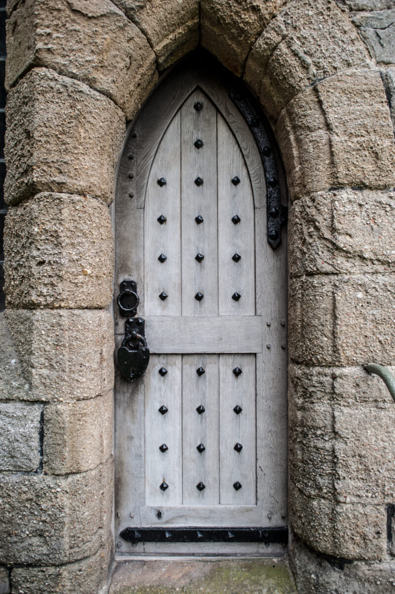 Stone arched doorway showing robust masonry construction at Caernarfon Castle