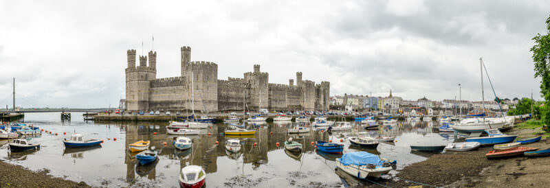 Panoramic exterior view showing polygonal towers of Caernarfon Castle