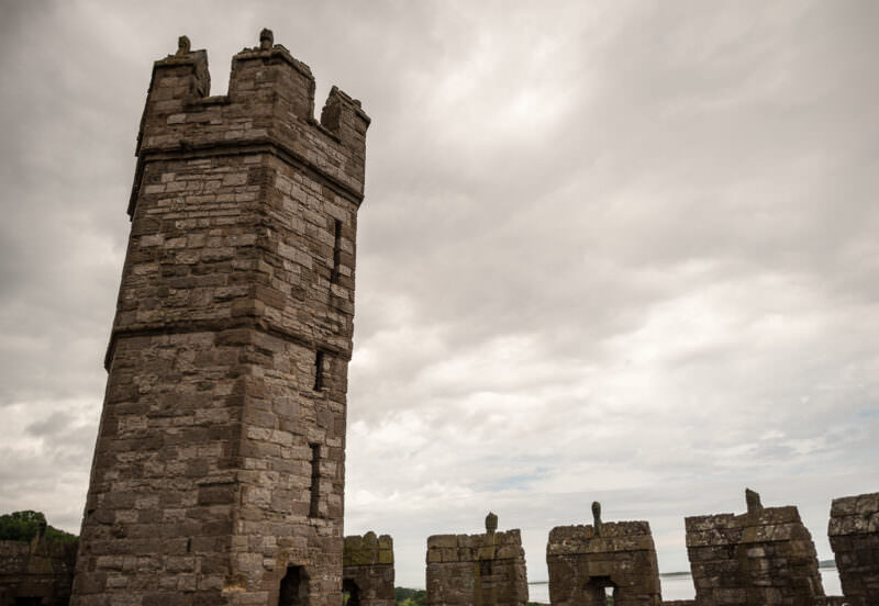 Storm clouds gathering over ramparts of Caernarfon Castle in northwest Wales