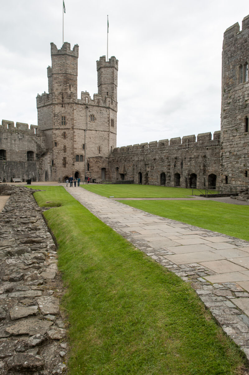 Ramparts framing interior courtyard with polygonal towers at Caernarfon Castle