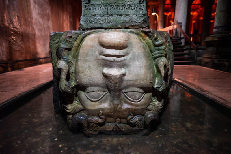 Upside-down Medusa head carved at the base of a column in the Basilica Cistern