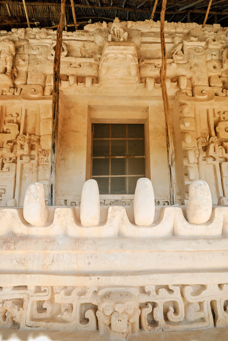 Monster-mouth threshold of the Sak Xok Naah at Ek' Balam, with rounded stucco teeth and glyph panels above
