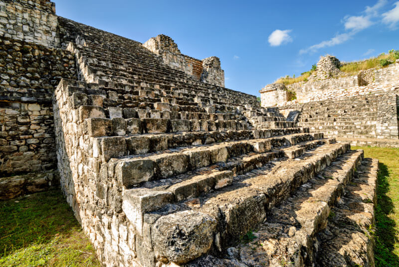Structure 17 at Ek' Balam rising from the South Plaza, with broad limestone staircase and twin ruined temples