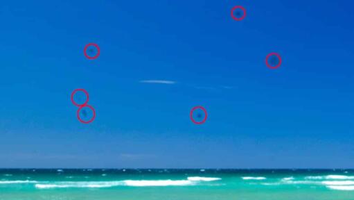 Example of dust bunny spots on an image from dust on a DSLR sensor