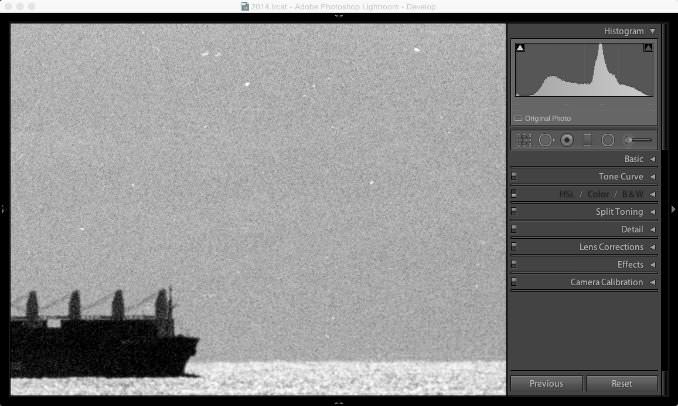 Screenshot of Lightroom Classic with black and white scanned image with dust spots and scratches on the original negative - closer view
