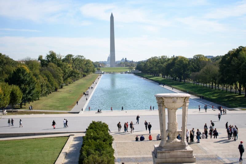 View over the Reflecting Pool toward the Washington Monument with a marble urn in foreground