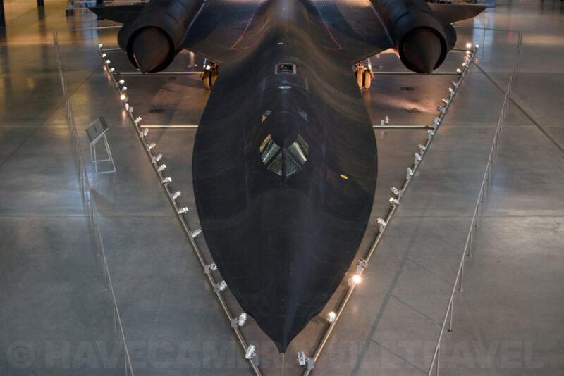 Lockheed SR-71 Blackbird viewed head-on from below, showing its dark angular fuselage