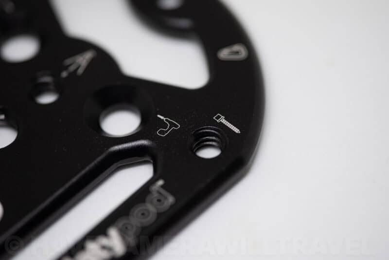 Close-up of engraved icons and threaded mounting holes on the Platypod Ultra plate