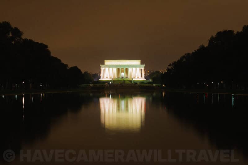 The Lincoln Memorial illuminated at night reflected in the still Reflecting Pool