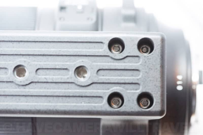 Close-up of four hex screws securing the stock foot to the Sigma 150-600mm Sports lens