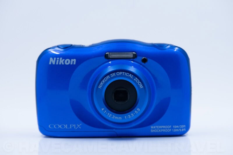 Nikon Coolpix W100 waterproof camera in blue, front view with lens and flash visible