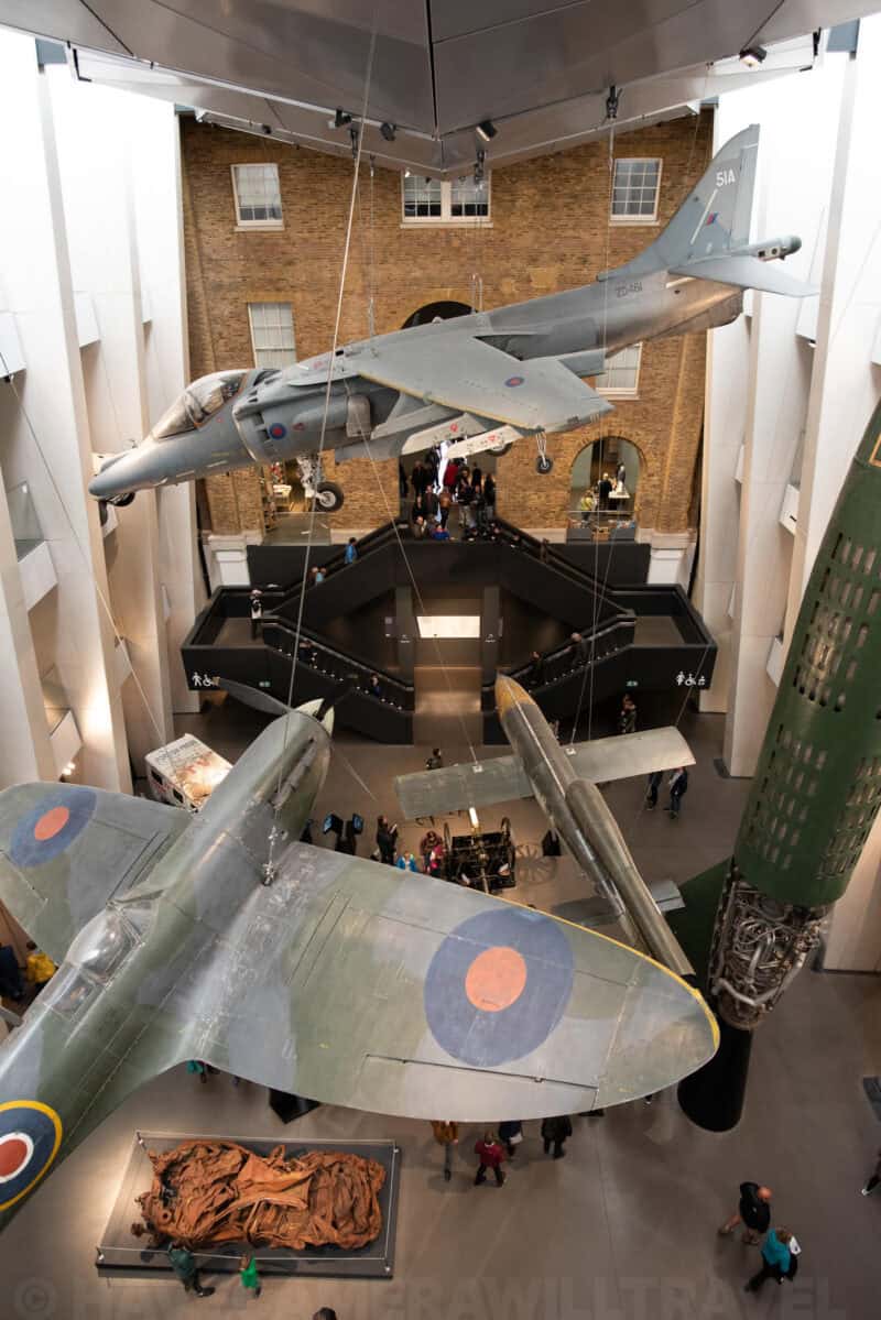 Harrier jet and Spitfire aircraft suspended above the atrium at the Imperial War Museum
