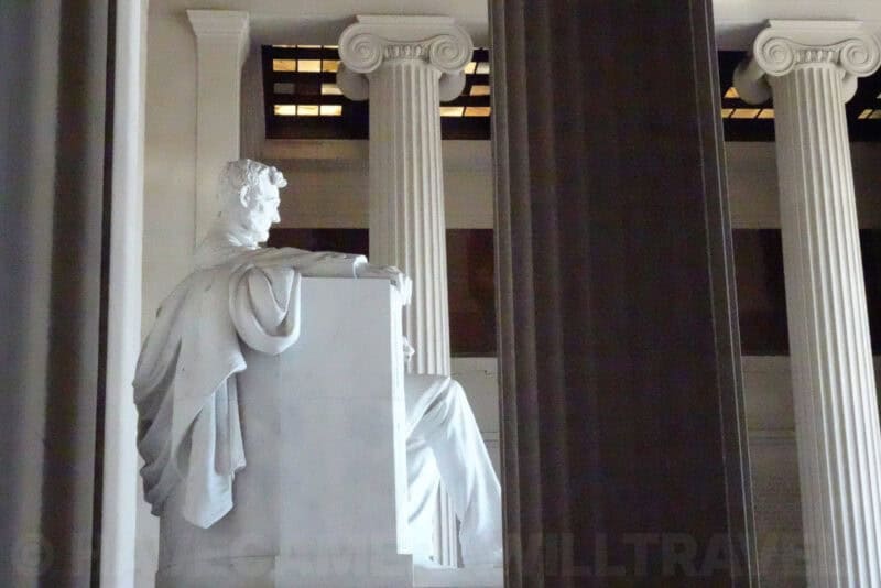 Lincoln Memorial statue framed between tall fluted Ionic columns