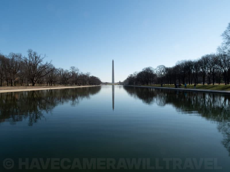 Washington Monument reflected in the Lincoln Memorial Reflecting Pool under a clear blue sky