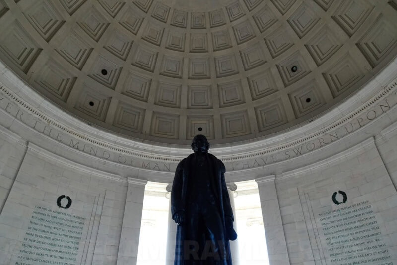 Thomas Jefferson statue standing beneath the domed ceiling of the Jefferson Memorial
