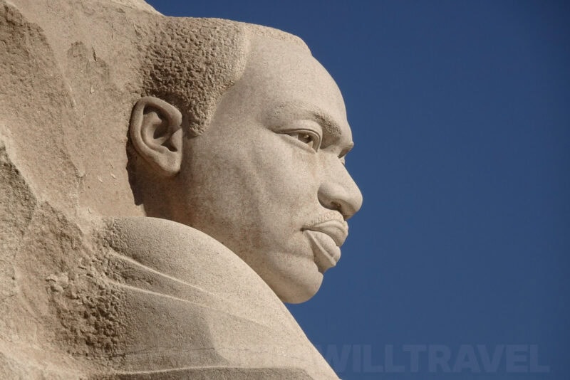 Martin Luther King Jr. Memorial statue profile carved from stone against a blue sky