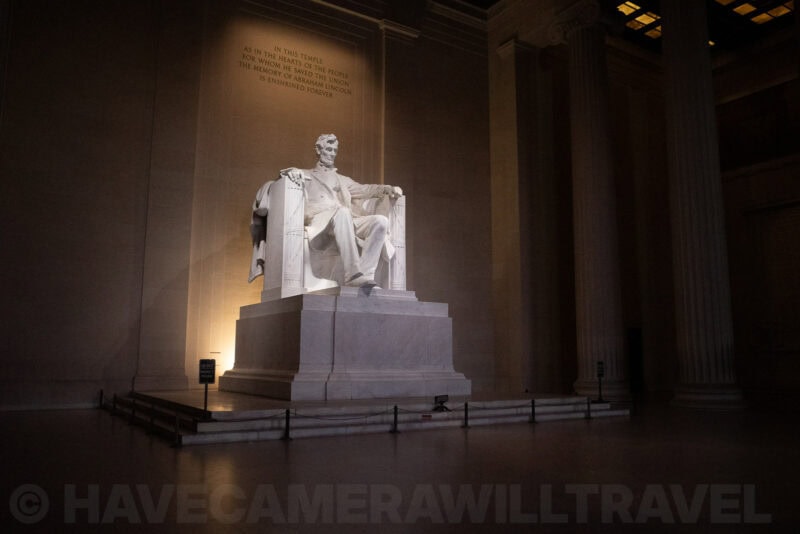 Lincoln Memorial statue illuminated inside its columned marble chamber at night