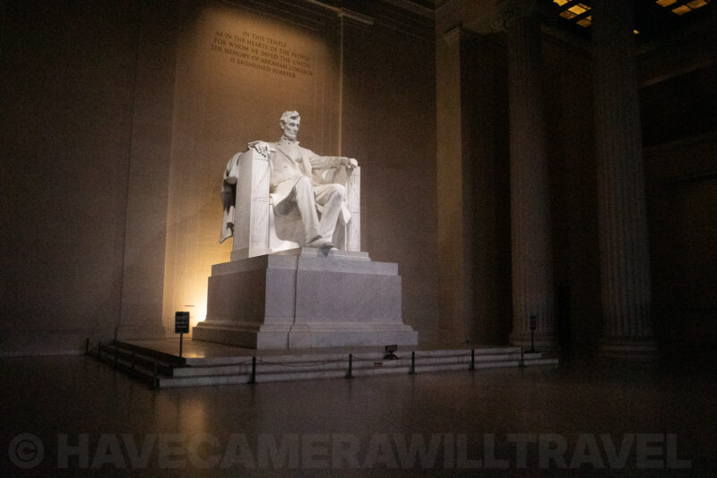 Lincoln Memorial statue lit inside its columned marble chamber at night