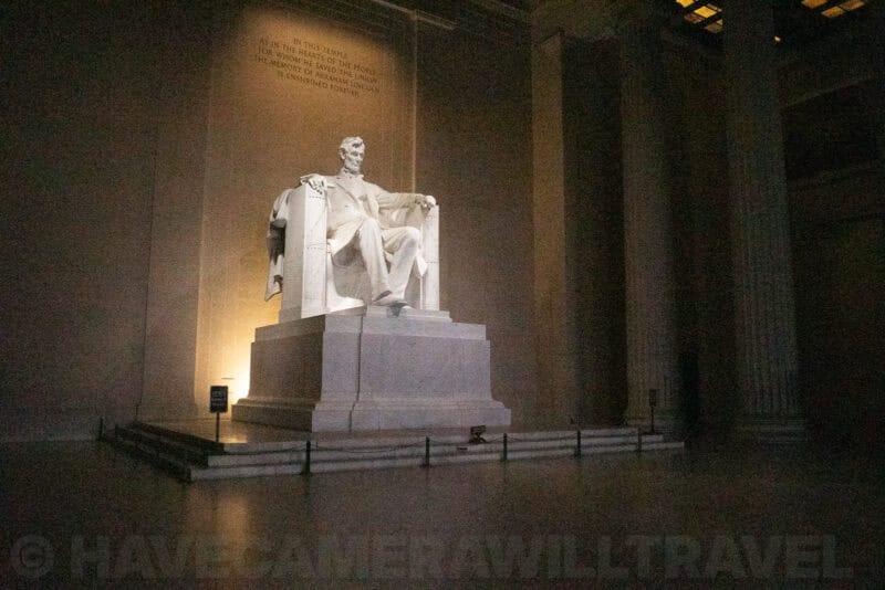 Lincoln Memorial statue illuminated inside its marble colonnaded hall at night