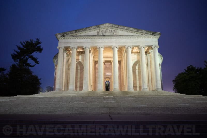Jefferson Memorial illuminated at dusk viewed from its front steps