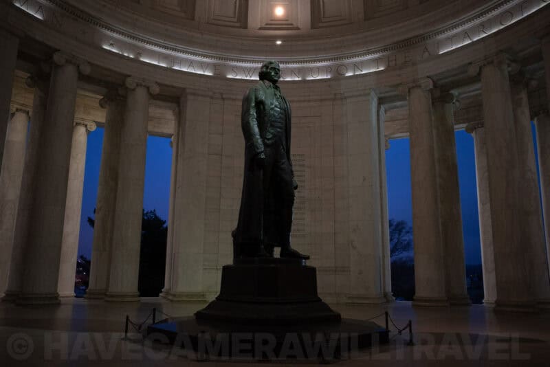 Thomas Jefferson statue inside the Jefferson Memorial rotunda at dusk